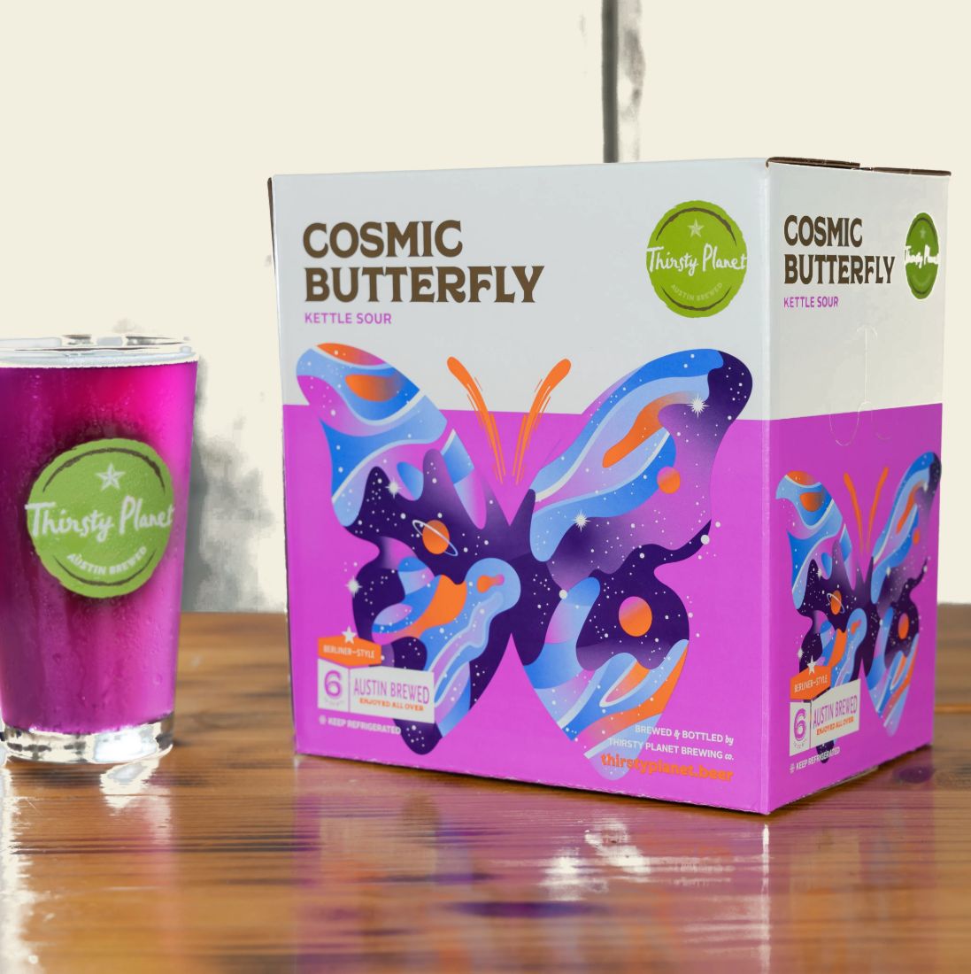 Cosmic Butterfly six-pack with a poured glass