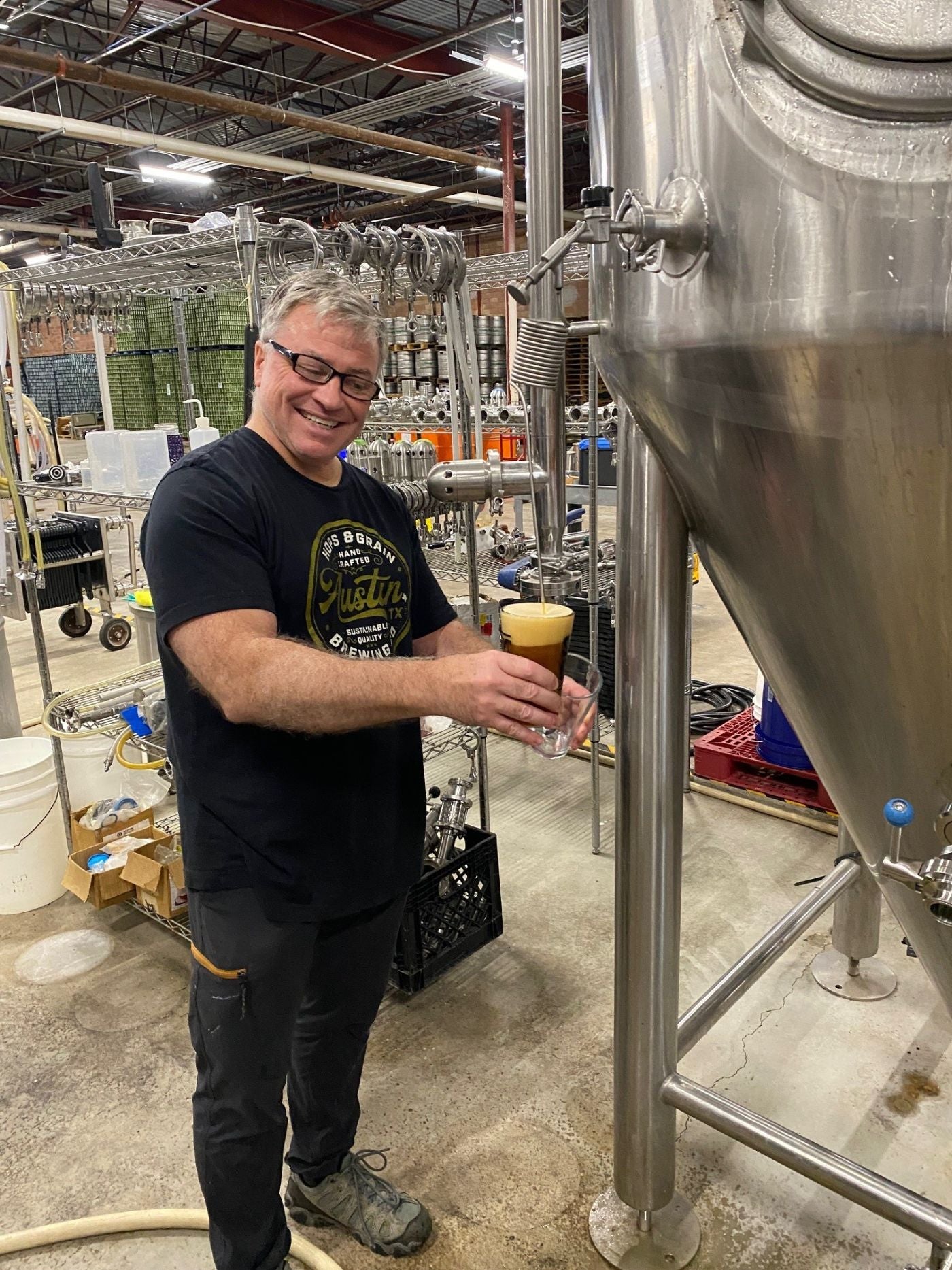 Brian Smittle pulling a sample from a fermenter