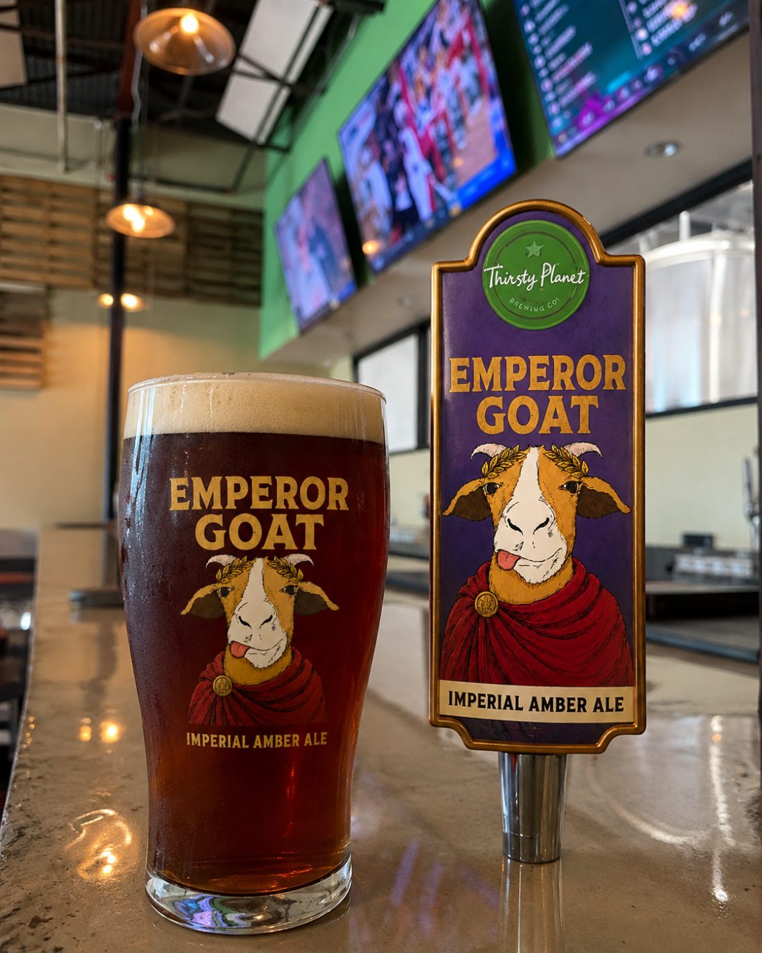 Emperor Goat Imperial Amber Ale on tap — pint and tap handle