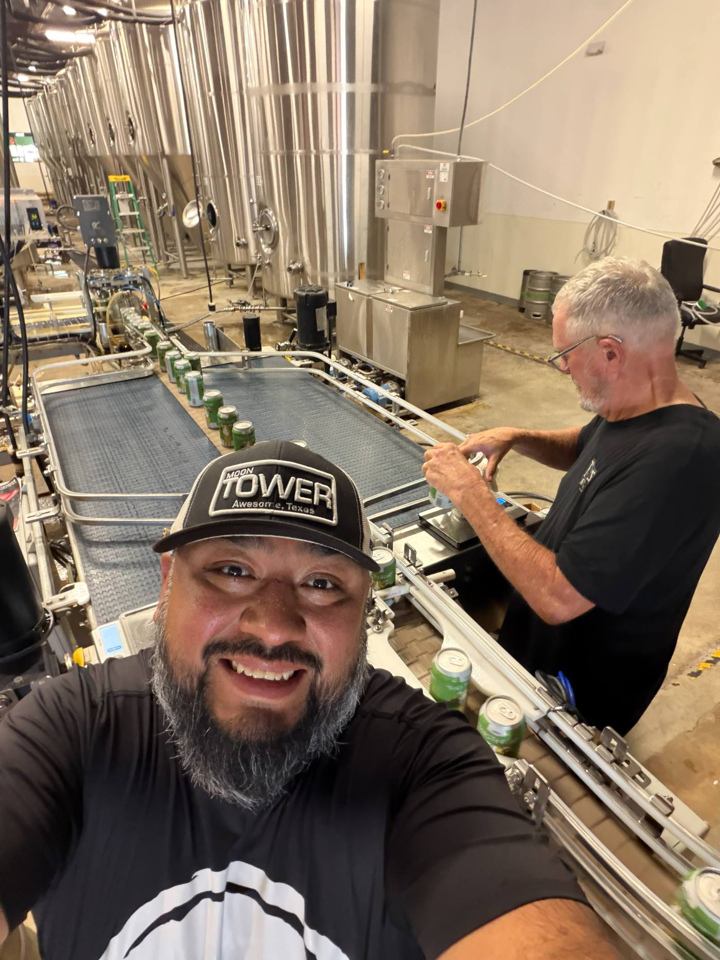 Cans moving along the canning line at the brewery